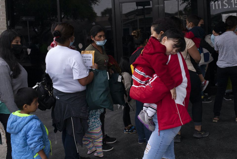 Immigrants line up March 23 at the Humanitarian Respite Center in McAllen, Texas. (Nuri Vallbona)
