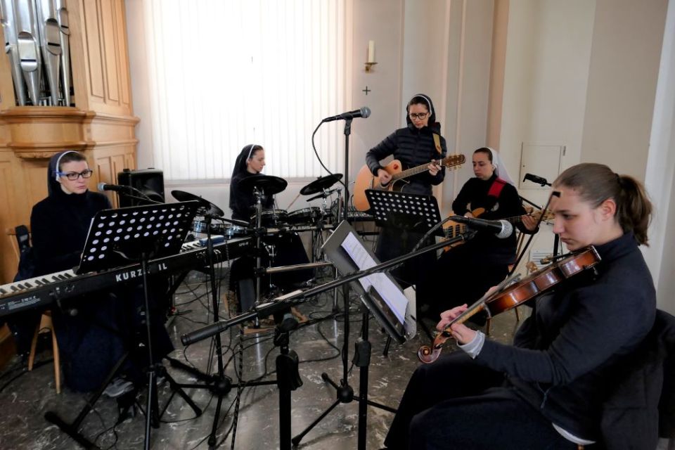 The music group of St. Joseph of Saint-Marc convent in Mukachevo, Ukraine, is made up of, from left, Sister Laura (keyboard), Sister Erika (drums), Sister Christina (guitar), Sister Marina (vocals) and Sister Natalka (violin).
