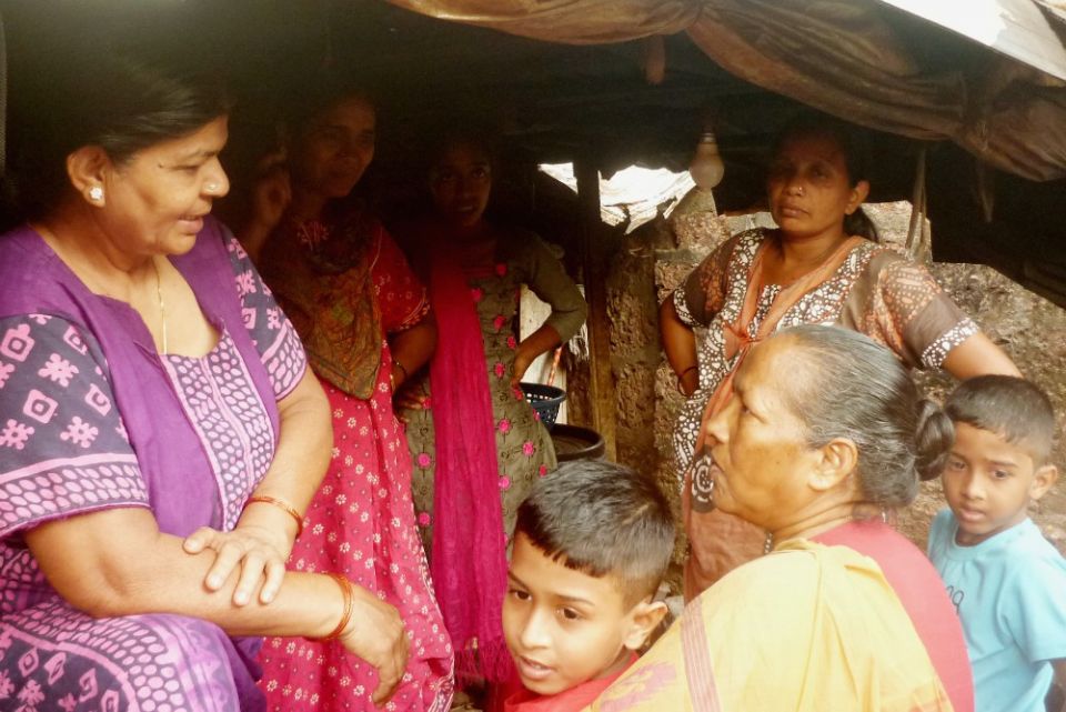 Sr. Marie Lou Barboza, lower right, touches base with a migrant woman at her home after work in Saligao, a village in Goa, western India. (Lissy Maruthanakuzhy) Sr. Marie Lou Barboza, lower right, touches base with a migrant woman at her home after work in Saligao, a village in Goa, western India. (Lissy Maruthanakuzhy)