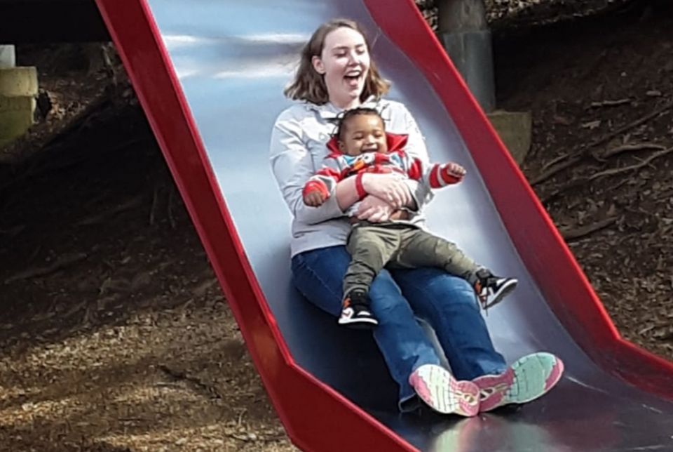 Mary-Teresa Robinette, Change a Heart Franciscan Volunteer Program volunteer, joins a child from Angels' Place in Pittsburgh on the slide in March 2020. (Provided photo) Mary-Teresa Robinette, Change a Heart Franciscan Volunteer Program volunteer, joins a child from Angels' Place in Pittsburgh on the slide in March 2020. (Provided photo)