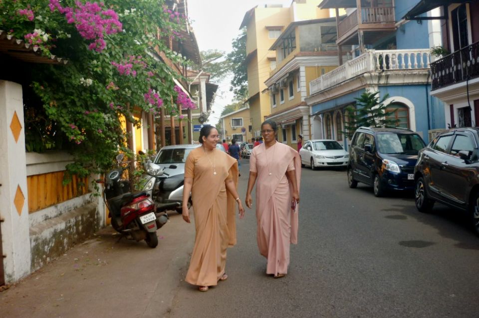 Sr. Rosy Mathew and Sr. Celine Sebastian walk on their way to visiting families. (Lissy Maruthanakuzhy)