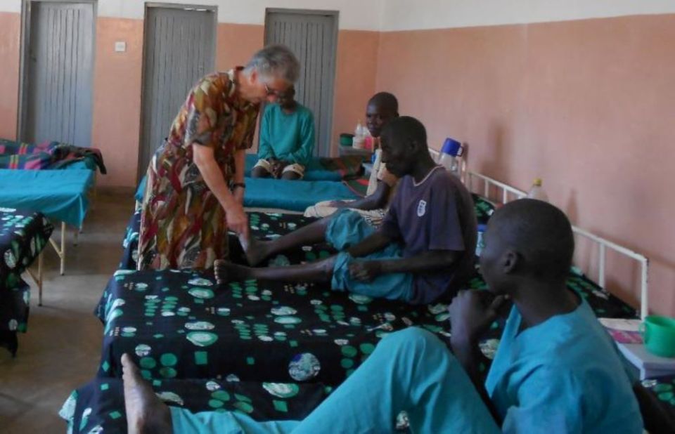 Sr. Anna Tommasi checks a patient in the sick bay at Chichiri Prison in Blantyre, Malawi. Malawi's prisons are known for their harsh conditions. Tommasi facilitated the construction of a multipurpose sick bay to isolate ill inmates.