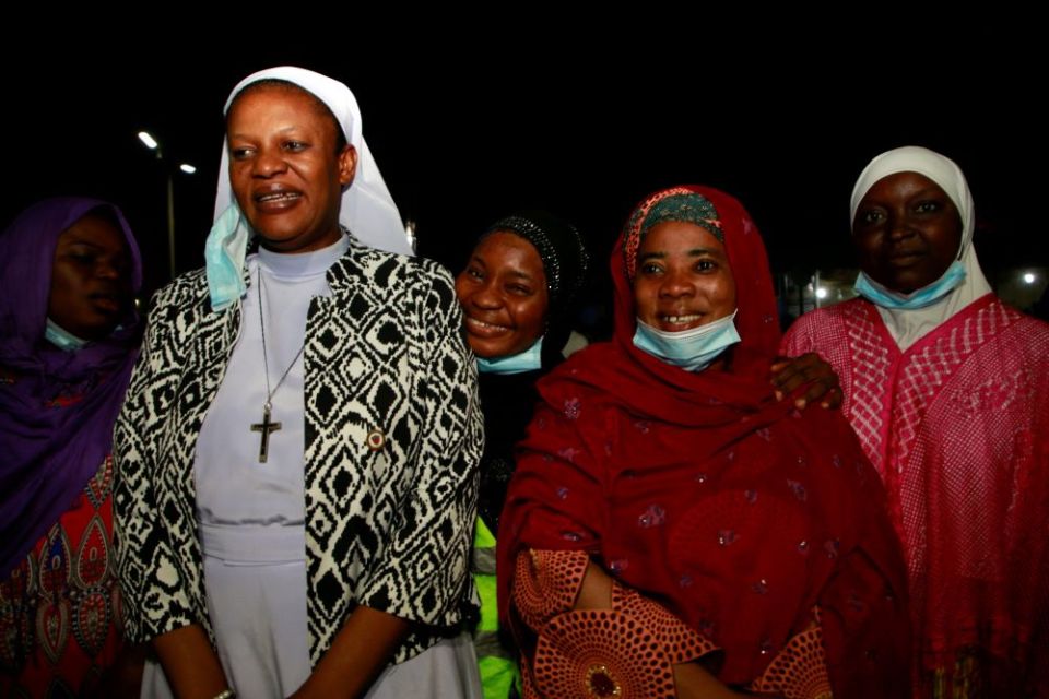 Sr. Agatha Chikelue, left, executive director of the Cardinal Onaiyekan Foundation for Peace in Abuja, Nigeria, stands with Muslim women after they broke their fast at Al-Habbiyah Mosque in April 2021. (CNS/Reuters/Afolabi Sotunde)