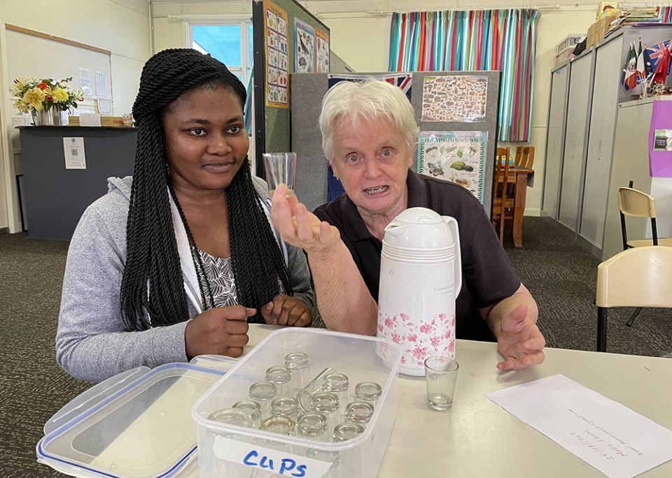 Dominican Sr. Diana Santleben, founder of Zara's House for refugees in Newcastle, New South Wales, meets with a new financial coordinator, Mary Amponsah. (Tracey Edstein)