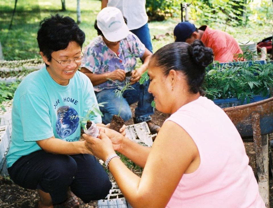 Maryknoll Sr. Joji Fenixm, left, is working to preserve native trees and plant life at a tree nursery at the Maryknoll Sisters Pastoral Care Center in Darien, Panama.