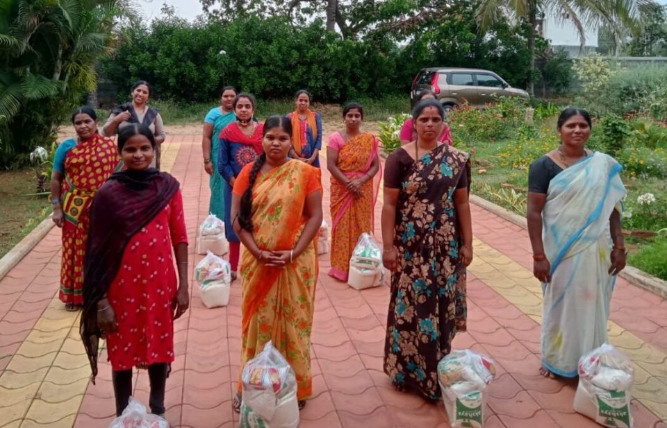 More than 4,000 people, including 800 families, received food kits in the villages around the Salesian-run Ferrando Center for Vocational Training in Srirampura, India. The women here are beneficiaries. (Courtesy of Salesian Missions USA)