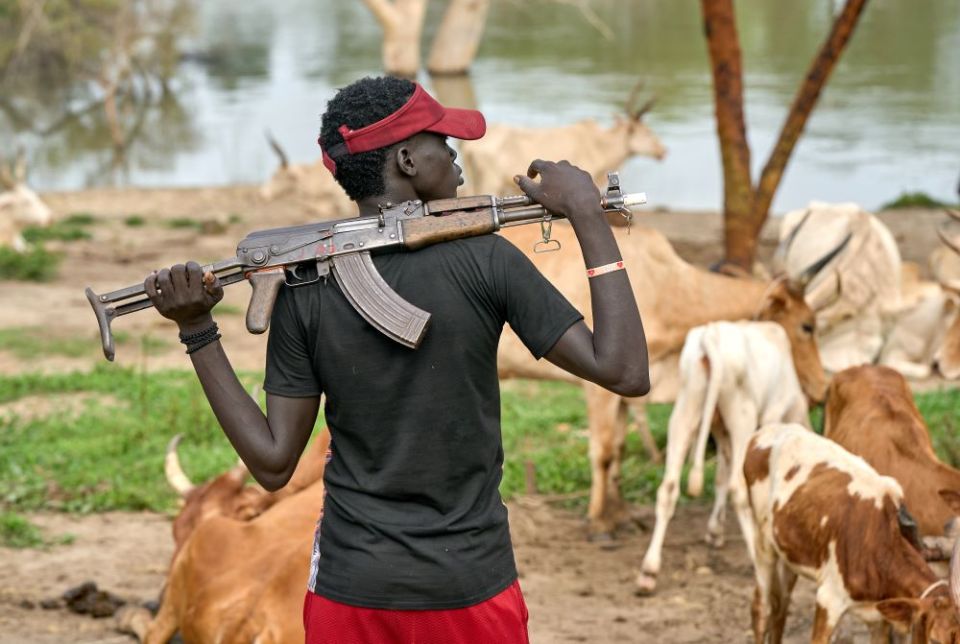 A cattle keeper holds an assault rifle in Mogok, South Sudan, Sept. 1, 2021.(CNS photo/Paul Jeffrey)