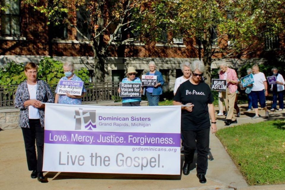 Sr. Maureen Geary, front left, marches with other Grand Rapids Dominican sisters in 2019 as the congregation calls for love and justice. Geary is president-elect of the Leadership Conference of Women Religious, which represents about 80% of the nuns and s