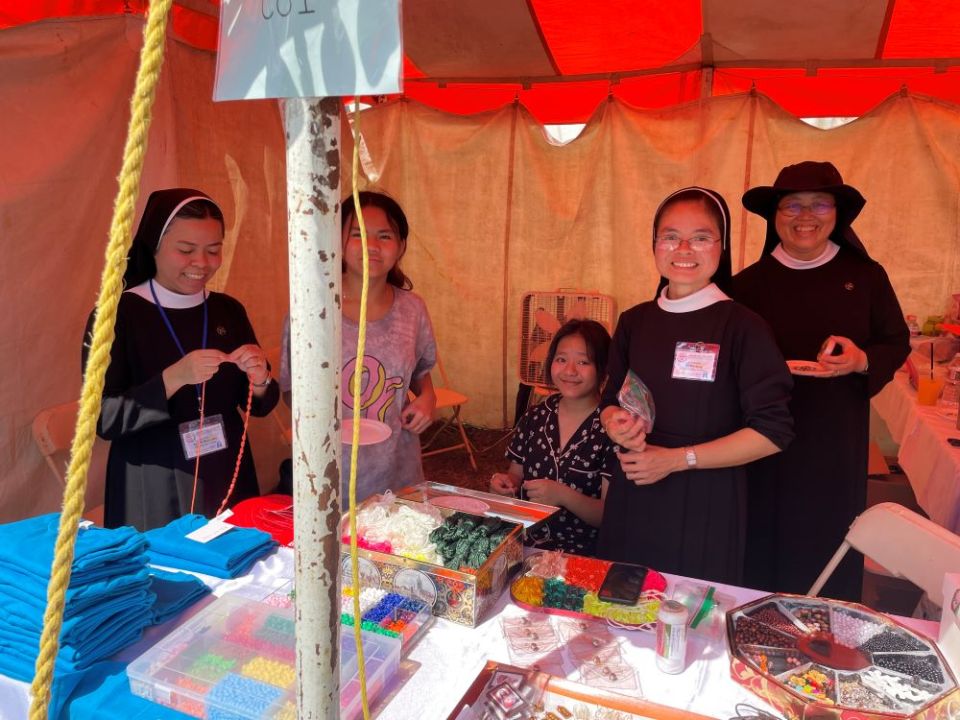 The event was attended by several women's religious groups. This is a religious gift shop for lovers of the Holy Cross.  (Peter Tran)