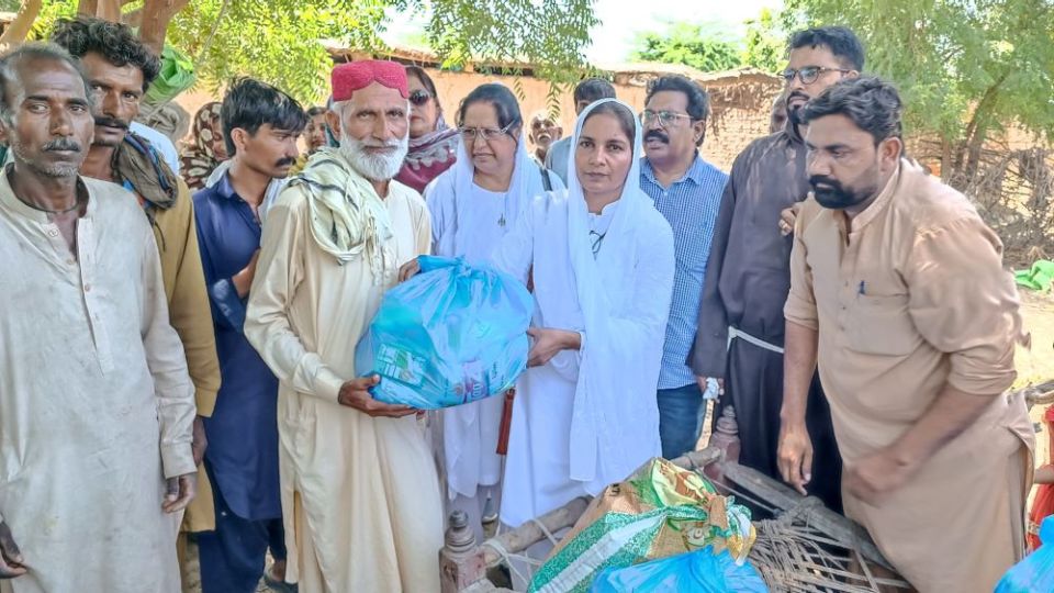 Franciscan Missionaries of Mary Sr. Iffat Inayat (right) and Fr. Shahzad Khokher distributed food packages to 50 families in Tando Adam, Sindh. (Courtesy Fr. Shahzad Khokher)