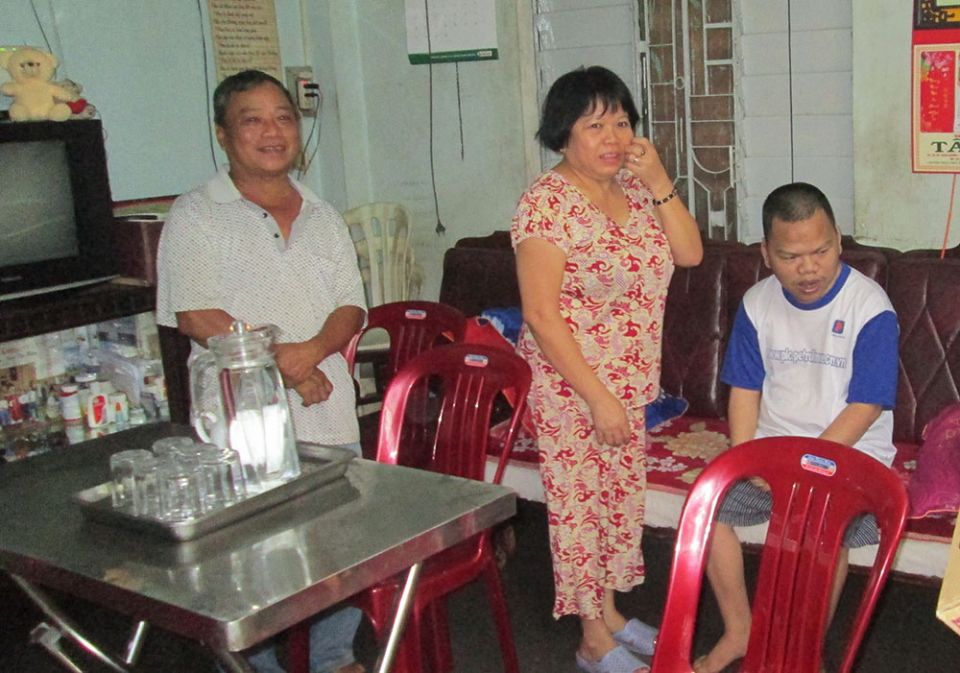 Agnes Ho Thi Linh, center, and her son, Ignatius Pham Hoai Tuan, right, at their home in Thuan Loc ward in Hue, Vietnam, on Feb. 28. (Joachim Pham)