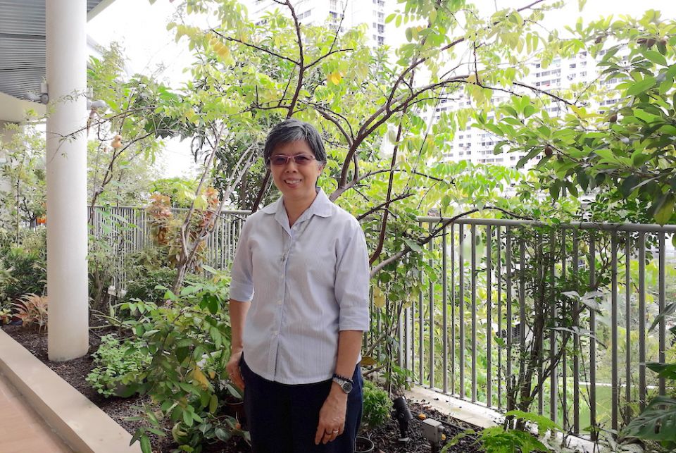 Good Shepherd Sr. Agnes-Claire Koh poses in front of the Good Shepherd Sisters' main convent; public housing can be seen in the background. (Provided photo) Good Shepherd Sr. Agnes-Claire Koh poses in front of the Good Shepherd Sisters' main convent; public housing can be seen in the background. (Provided photo)