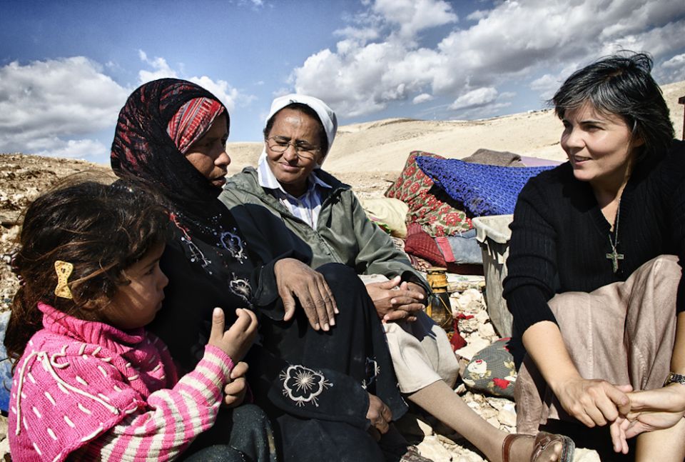 Comboni Sr. Alicia Vacas Moro, right, with Sr. Azezet Habtezghi, center, and a Bedouin family in the desert of Juda on the West Bank after the family's home had been demolished by Israel Defense Forces in 2013 (Courtesy of Sr. Alicia Vacas Moro) Comboni Sr. Alicia Vacas Moro, right, with Sr. Azezet Habtezghi, center, and a Bedouin family in the desert of Juda on the West Bank after the family's home had been demolished by Israel Defense Forces in 2013 (Courtesy of Sr. Alicia Vacas Moro)