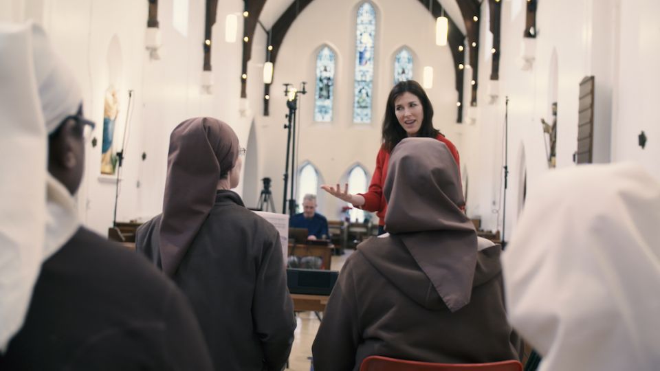 Opera singer Juliette Pochin, standing, works with members of the Poor Clares of Arundel to finesse their singing for the CD's recordings. (Morgan Pochin Music Productions)