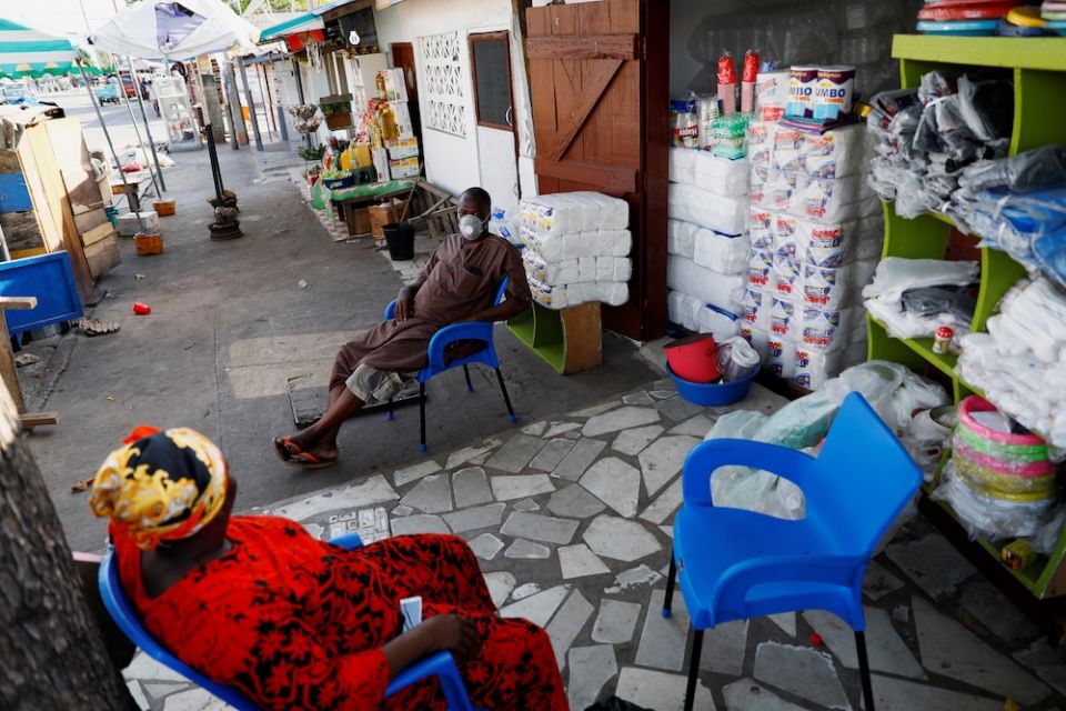 Traders sit in front of their shop in Accra, Ghana, April 20, 2020, during the COVID-19 pandemic. (CNS/Reuters/Francis Kokoroko)