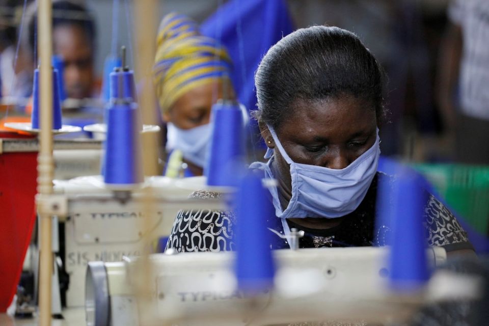 Workers of an Accra, Ghana, factory begin the production of personal protective gear for local frontline health workers April 10, 2020, during the coronavirus pandemic. (CNS/Reuters/Francis Kokoroko)