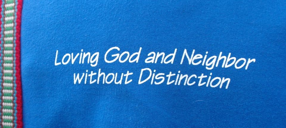 Congregation of St. Joseph sisters' mission statement, "Loving God and Neighbor without Distinction," embroidered on the back of a sister's shirt (Courtesy of the Congregation of St. Joseph)