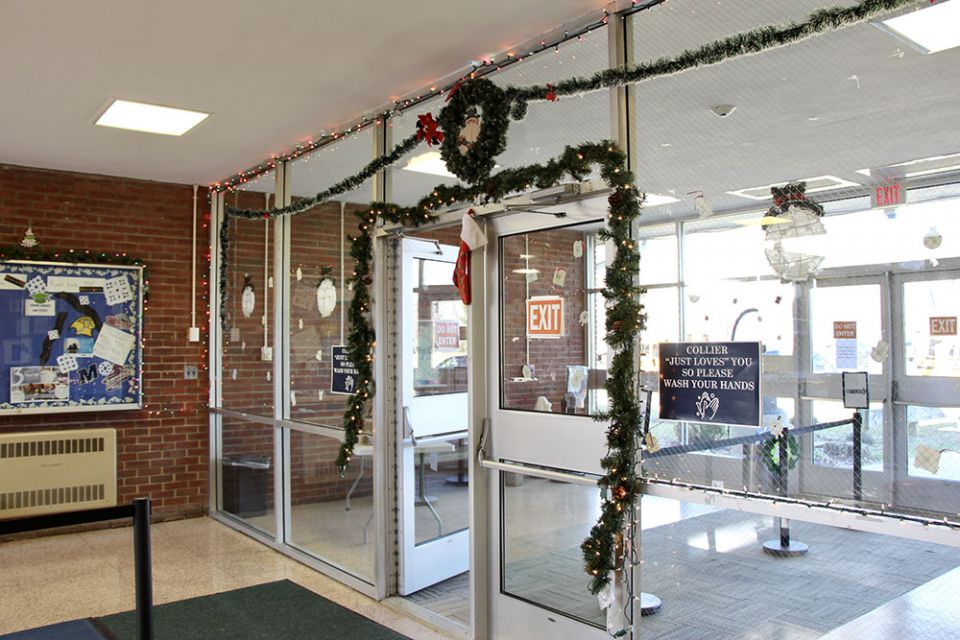 Collier High School's lobby is decorated to celebrate the holidays. Staff members go out of their way to celebrate the students' different traditions, and a festive lobby is one way they make this happen. (Maddie Thompson) Collier High School's lobby is decorated to celebrate the holidays. Staff members go out of their way to celebrate the students' different traditions, and a festive lobby is one way they make this happen. (Maddie Thompson)