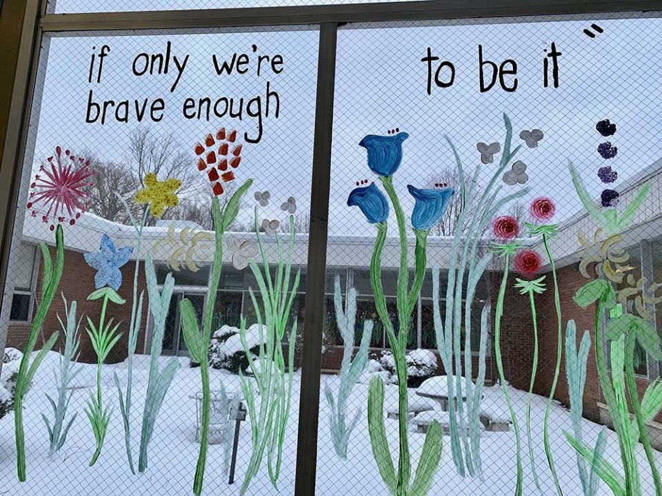 A quote from Amanda Gorman's poem "The Hill We Climb" on windows at Collier High School (Maddie Thompson)