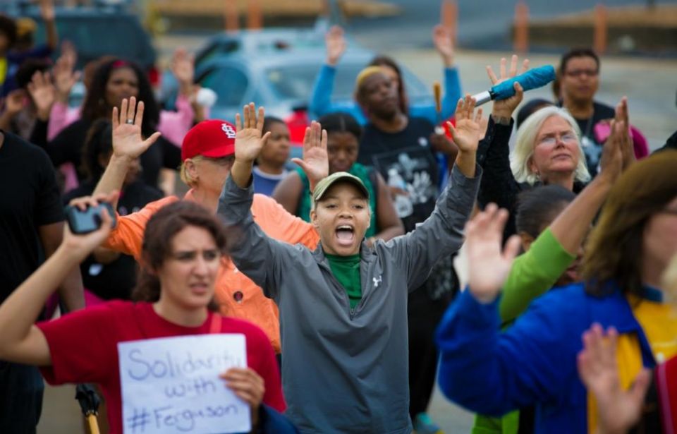 Protesters hold their hands in the air during an Aug. 16, 2014, demonstration against the shooting death of Michael Brown in Ferguson, Missouri.