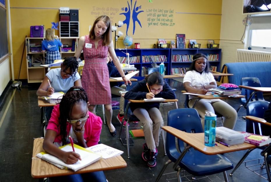 Sr. Sarah Heger, a Sister of St. Joseph of Carondelet, with students at Marian Middle School in St. Louis. Sr. Sarah Heger, a Sister of St. Joseph of Carondelet, with students at Marian Middle School in St. Louis.