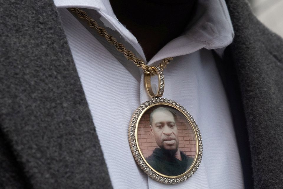 An image of George Floyd hangs from a necklace worn by a family member after an April 19 prayer session outside the Hennepin County Government Center in Minneapolis. (CNS/Reuters/Adrees Latif) An image of George Floyd hangs from a necklace worn by a family member after an April 19 prayer session outside the Hennepin County Government Center in Minneapolis. (CNS/Reuters/Adrees Latif)
