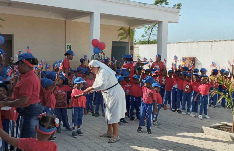 The school celebrates a fiesta de la bandera, Flag Day, each May to honor the Haitian revolution. (Courtesy of Gloria Inés Gonzales Ramírez) The school celebrates a fiesta de la bandera, Flag Day, each May to honor the Haitian revolution. (Courtesy of Gloria Inés Gonzales Ramírez)