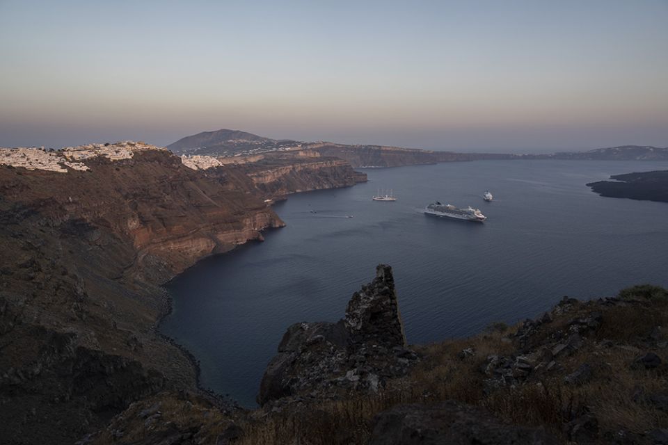 Ruins of a settlement, including a former Catholic monastery, lie on the rocky promontory of Skaros on the Greek island of Santorini June 15. (AP/Petros Giannakouris)