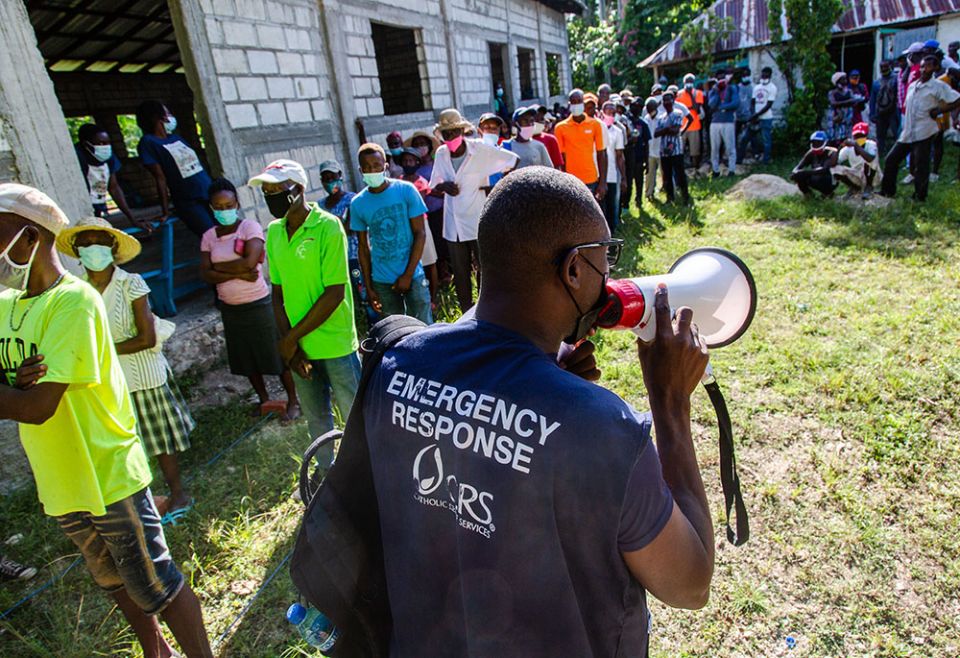 Haitians affected by the August 2021 earthquake in southern Haiti are seen in September at a Catholic Relief Services distribution site in the locality of Kay Raymond, Petit-Trou-de-Nippes, Haiti. (Catholic Relief Services/Georges Harry Rouzier) Haitians affected by the August 2021 earthquake in southern Haiti are seen in September at a Catholic Relief Services distribution site in the locality of Kay Raymond, Petit-Trou-de-Nippes, Haiti. (Catholic Relief Services/Georges Harry Rouzier)