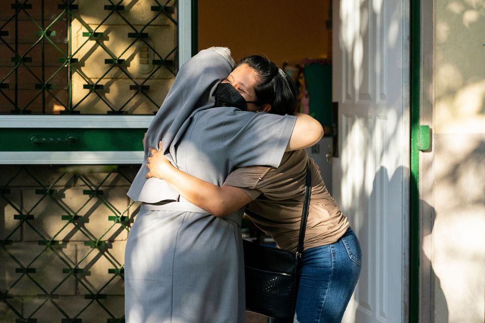 Sr. María San Martín hugs a student at the Virgin of Suyapa Center in Choloma, Honduras. (Gregg Brekke) Sr. María San Martín hugs a student at the Virgin of Suyapa Center in Choloma, Honduras. (Gregg Brekke)