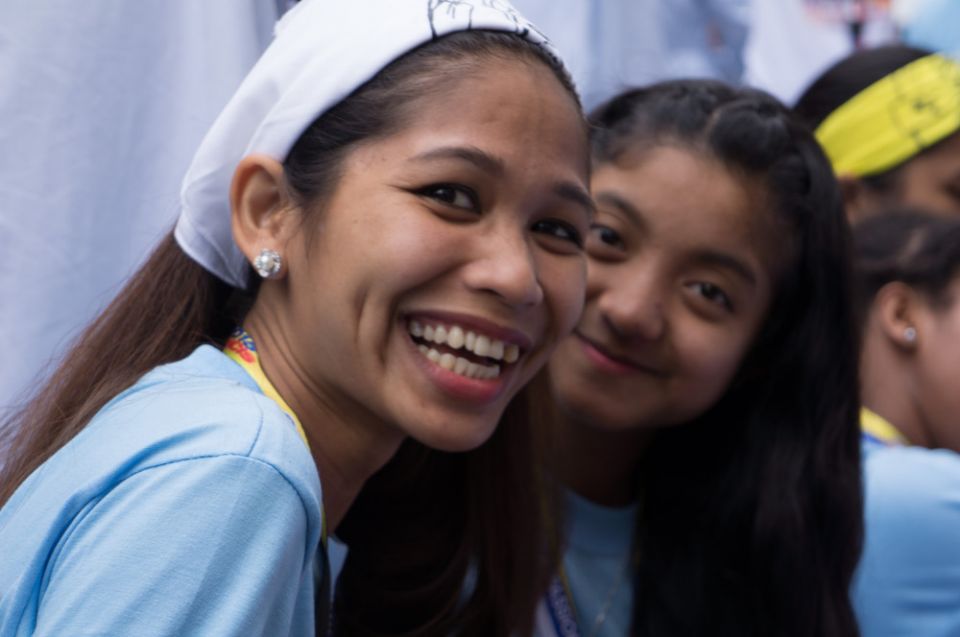Jane Ollivier, pictured at left in 2015, entered the School of Life at age 15 after being orphaned and passed around various relatives. Smiling Jane Ollivier with another younger girl