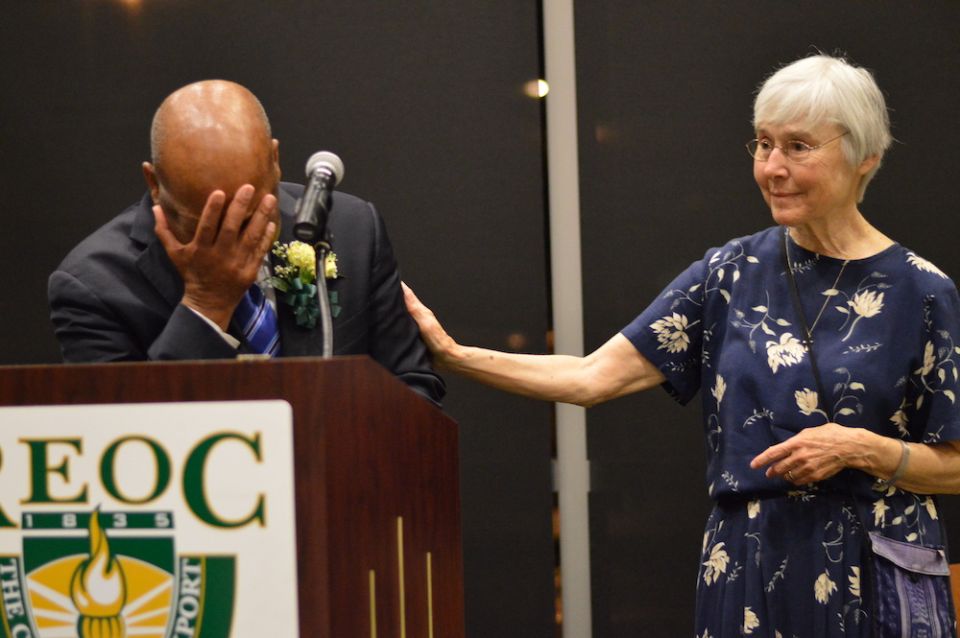 St. Joseph Sr. Barbara Lum, right, comforts U.S. Rep. John Lewis at the Rochester Education Opportunity Center's graduation ceremony May 13, 2014, as he speaks about the sisters who cared for him on Bloody Sunday in 1965. Lum was on the center's nursing f