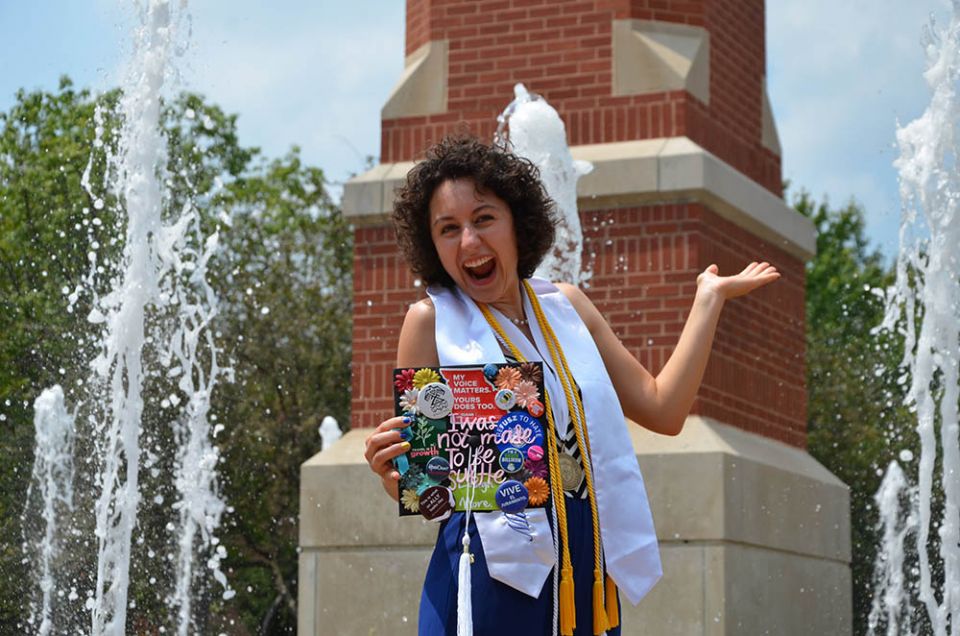 Julia Gerwe celebrates her (postponed) graduation from St. Louis University in August 2021, showing off her decorated graduation cap, which reads: "I was not made to be subtle."