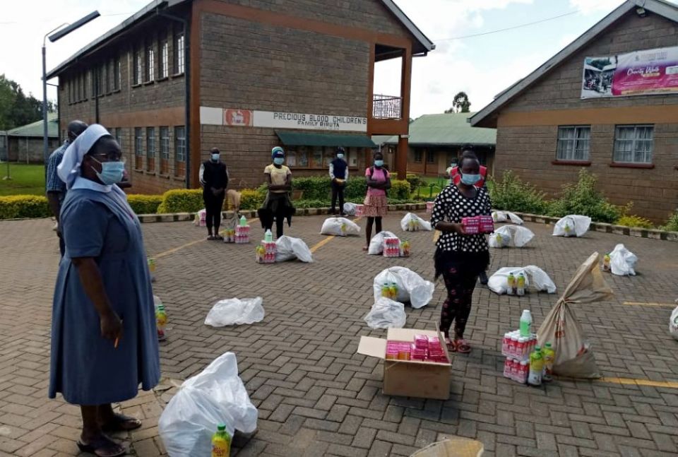Sr. Ann Grace Njau of the Missionary Sisters of the Precious Blood distributes sanitary pads and other essentials to girls from Amani Rehab and Primary School in Nairobi. (Provided photo) Sr. Ann Grace Njau of the Missionary Sisters of the Precious Blood distributes sanitary pads and other essentials to girls from Amani Rehab and Primary School in Nairobi. (Provided photo)