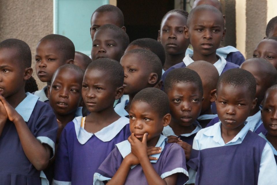 Kenyan schoolchildren listen to their teacher in June 2019 outside their classroom in Bungoma in western Kenya. According to UNESCO, the education of 1.54 billion pupils in 185 countries has been curtailed during the pandemic. (Doreen Ajiambo) Kenyan schoolchildren listen to their teacher in June 2019 outside their classroom in Bungoma in western Kenya. According to UNESCO, the education of 1.54 billion pupils in 185 countries has been curtailed during the pandemic. (Doreen Ajiambo)