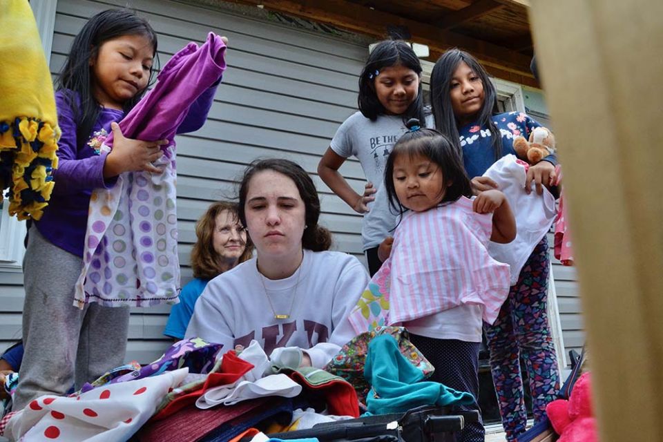 Mary Wagoner, in blue shirt, watches Lizzi Seyle, center, sort donated clothing May 23, for children whose homes were damaged by a Dec. 10, 2021, tornado in Mayfield, Kentucky. (GSR photo/Dan Stockman)