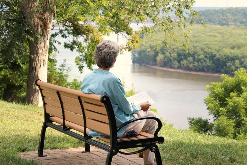 Sr. Lou Anglin of the Sisters of Charity of the Blessed Virgin Mary sits outdoors in quiet reflection in Dubuque, Iowa, as part of her participation in the Leadership Conference of Women Religious' 2020 virtual assembly. (Courtesy of LCWR)