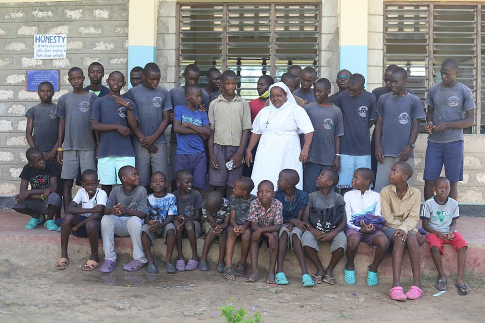 St. Joseph Sr. Jane Frances Kamanthe Malika is surrounded by children at Grandsons of Abraham Rescue Centre in Mombasa, Kenya. (GSR photo/Doreen Ajiambo)