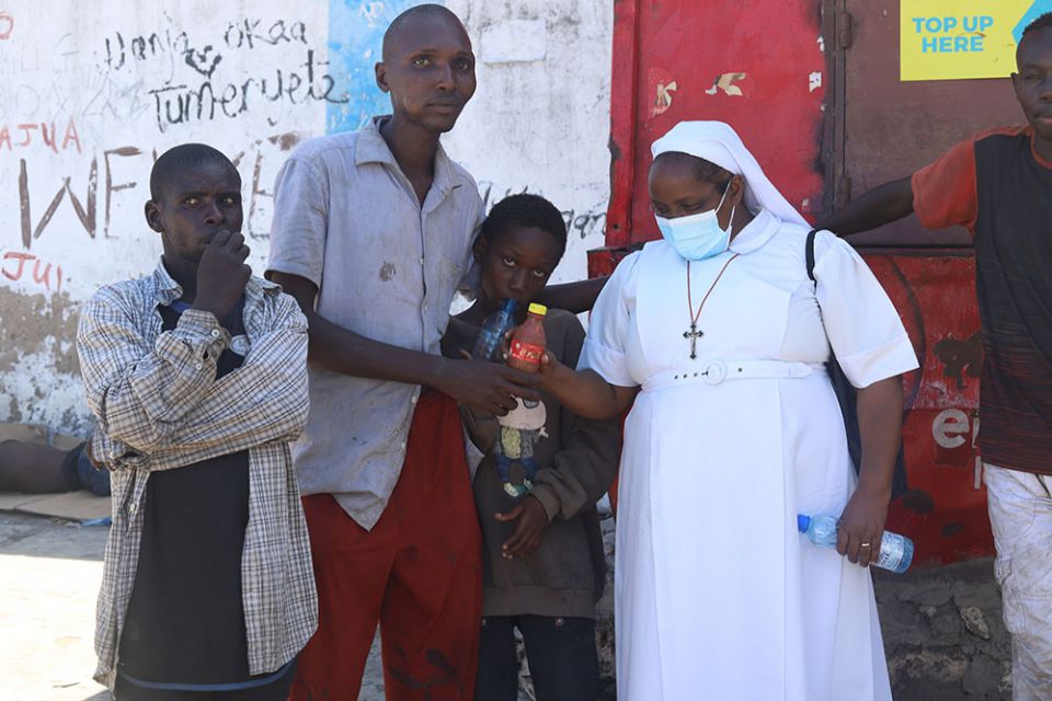 St. Joseph Sr. Jane Frances Kamanthe Malika advises youths in the streets of Mombasa, Kenya, about the effects of abusing drugs. (GSR photo/Doreen Ajiambo)