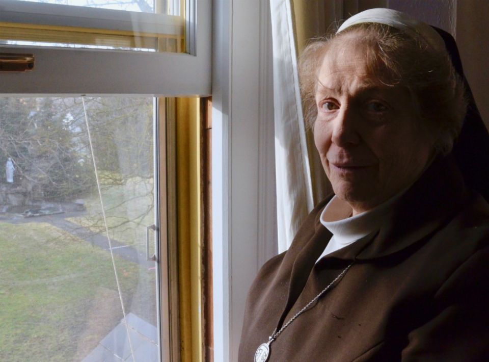 Sr. Marcia Kay LaCour, abbess of the Poor Clares in Spokane, Washington, at a window overlooking the grounds of the Monastery of St. Clare on Jan. 30 (GSR photo / Dan Stockman) Sr. Marcia Kay LaCour, abbess of the Poor Clares in Spokane, Washington, at a window overlooking the grounds of the Monastery of St. Clare on Jan. 30 (GSR photo / Dan Stockman)
