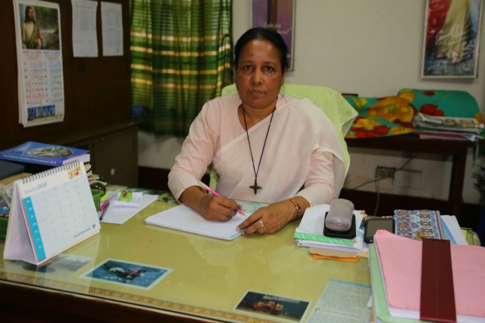 Sr. Mary Anna Gomes works at her office at Radio Veritas Asia, Bengali Service, in Dhaka, Bangladesh. (Sumon Corraya)