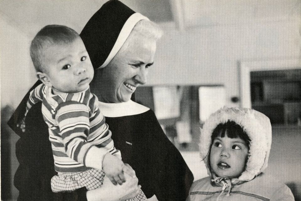 St. Joseph Sr. Mary Christine Taylor, a Sister of St. Joseph of Watertown, New York, with two children from the Mohawk Tribe on the St. Regis Mohawk Reservation in 1984 (Courtesy of Catholic Extension Magazine)