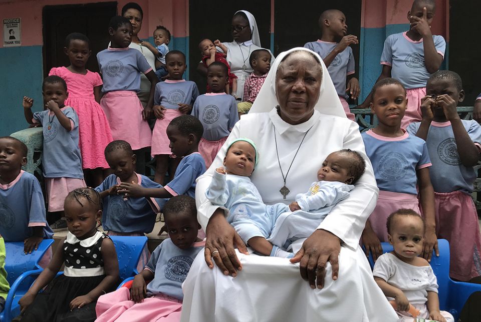 Sr. Matilda Inyang with some of the children at the Mother Charles Walker Children Home, which cares for malnourished and homeless children from the streets of Uyo, Nigeria (Valentine Iwenwanne)
