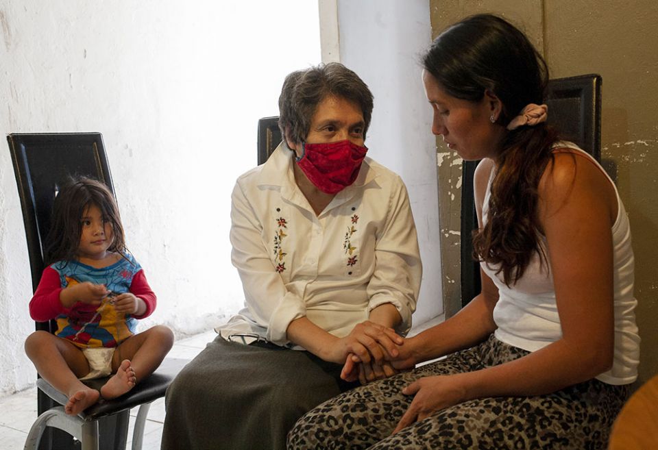 Sr. Mercedes Castillo, second from left, comforts Noelia Marlene Vásquez of Honduras while her daughter, Lindsey Gimena Rodas, 2, sits nearby at the El Buen Samaritano shelter in Nuevo Laredo, Mexico, on March 27. (Nuri Vallbona) Sr. Mercedes Castillo, second from left, comforts Noelia Marlene Vásquez of Honduras while her daughter, Lindsey Gimena Rodas, 2, sits nearby at the El Buen Samaritano shelter in Nuevo Laredo, Mexico, on March 27. (Nuri Vallbona)