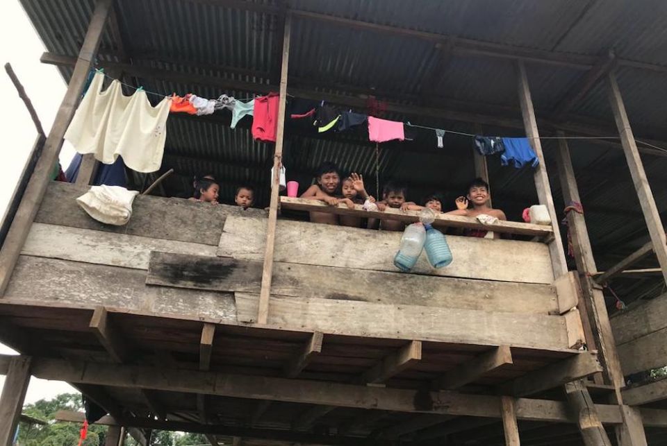 An Emberá family from the Cémaco region of Darién, Panama, greets a group distributing supplies. (Courtesy of Clara Meza)