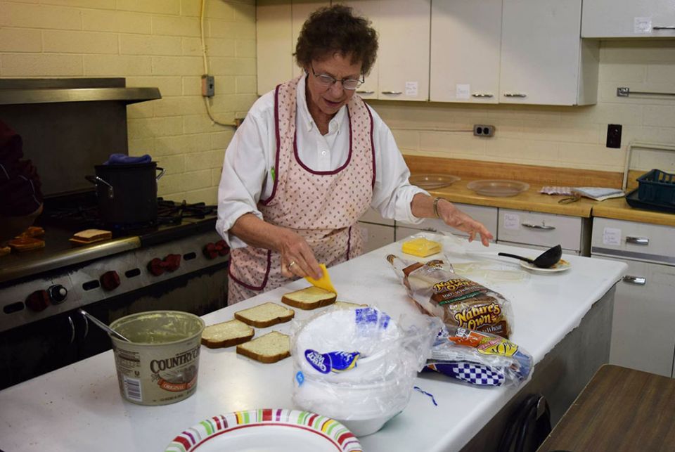 Sr. Patricia Bietsch prepares grilled cheese sandwiches in the St. Mary Mission hall kitchen, February 2016 in Tohatchi, New Mexico. (Julie A. Ferraro) Sr. Patricia Bietsch prepares grilled cheese sandwiches in the St. Mary Mission hall kitchen, February 2016 in Tohatchi, New Mexico. (Julie A. Ferraro)