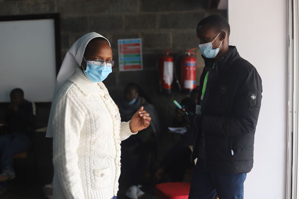 A religious sister displays her inked finger after casting her ballot Aug. 9 inside a polling station at the Milimani Primary School in Nairobi, Kenya. Voters in Kenya woke up early to vote to choose their next president between Raila Odinga, supported by