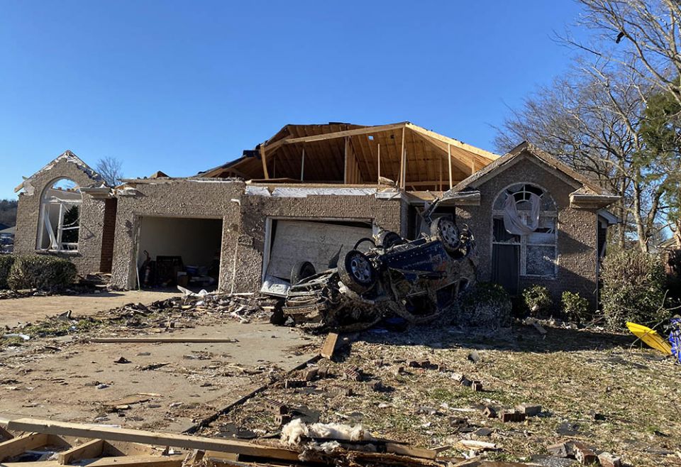 What remains of a home in Kentucky in the path of the Dec. 10, 2021, tornadoes, including (to the far left) an intact and standing Christmas tree that is a reminder of the devastating timing of the storms. (Courtesy of Ellen Sprigg)
