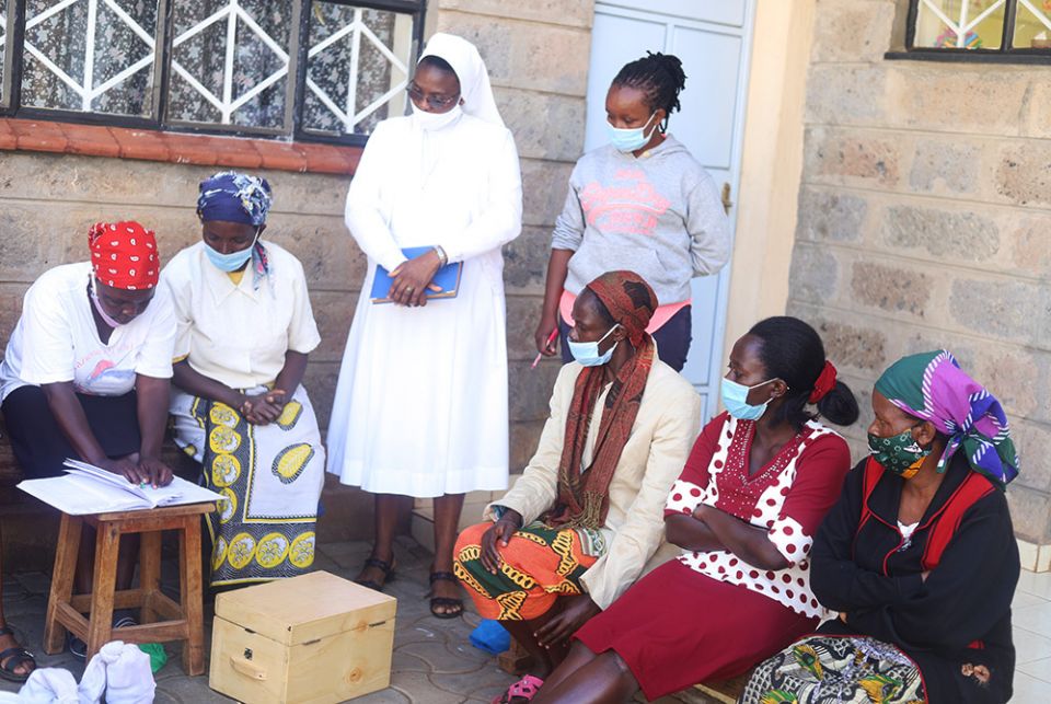 Sr. Gisele Mashauri of the Salesian Sisters of Don Bosco guides women on how to do the table banking in Dagoreti slum on the outskirts of Kenya's capital, Nairobi. (GSR photo/Doreen Ajiambo) Sr. Gisele Mashauri of the Salesian Sisters of Don Bosco guides women on how to do the table banking in Dagoreti slum on the outskirts of Kenya's capital, Nairobi. (GSR photo/Doreen Ajiambo)