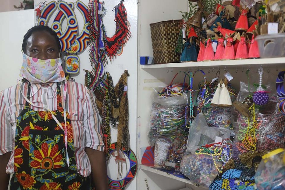 Gladys Wanjiru, 37, stands inside her jewelry shop in Dagoreti slum on the outskirts of Nairobi on Oct. 24, 2020. Wanjiru began her business after securing a loan from Savings and Internal Lending Communities. (GSR photo/Doreen Ajiambo) Gladys Wanjiru, 37, stands inside her jewelry shop in Dagoreti slum on the outskirts of Nairobi on Oct. 24, 2020. Wanjiru began her business after securing a loan from Savings and Internal Lending Communities. (GSR photo/Doreen Ajiambo)